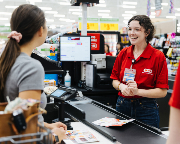 HEB cashier attending customer