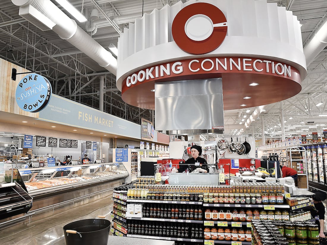 Employee working at an HEB grocery store.