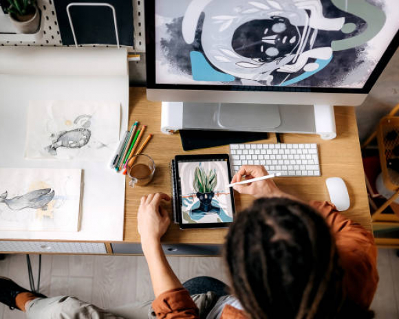 Digital illustrator drawing on a table