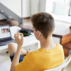 Teenager signing during e-learning session