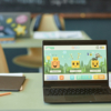 Open Laptop in Kids Classroom with Characters on Screen
