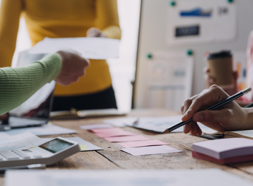 Businesswoman or accountant working Financial investment on calculator, calculate, analyze business and marketing growth on financial document data graph, Accounting, Economic, commercial concept.m