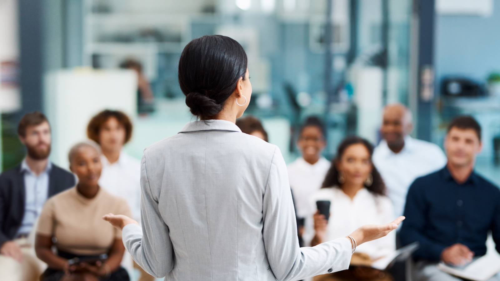 Rearview shot of an unrecognizable businesswoman giving a presentation in the office boardroom