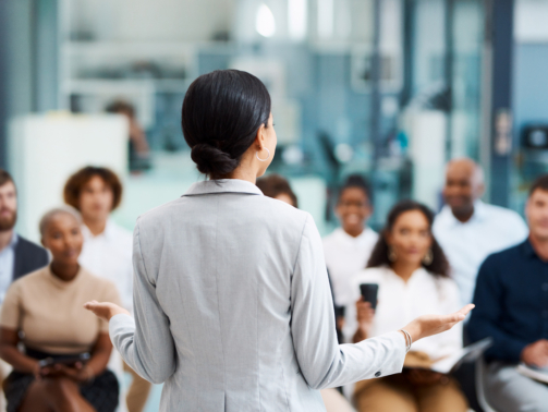 Rearview shot of an unrecognizable businesswoman giving a presentation in the office boardroom