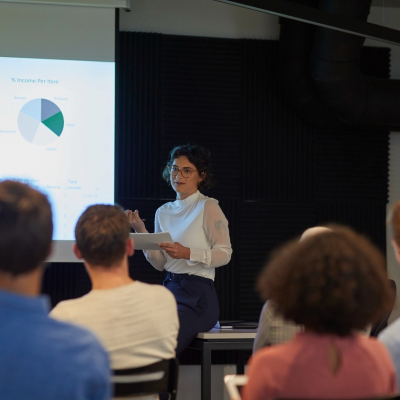 Woman conducting meeting.