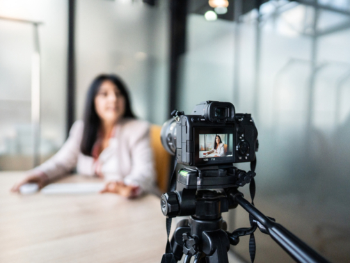 Businesswoman recording tutorial at office