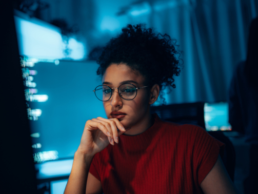 Young Hispanic woman in technology career, authentic portrait of programmer or cybersecurity professional