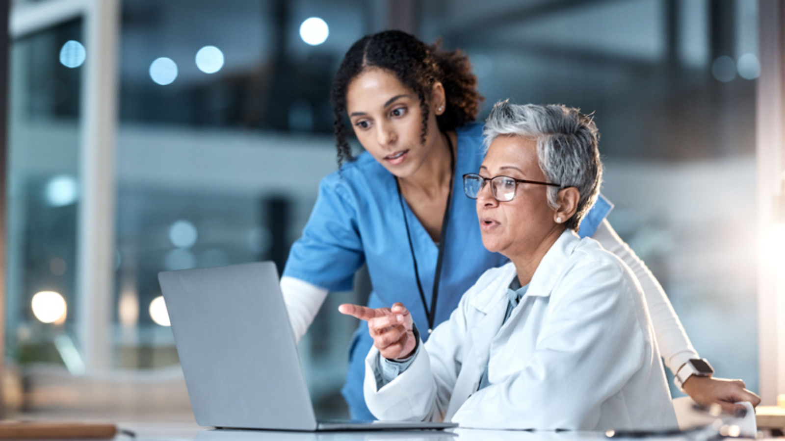 Doctors, nurse or laptop in night healthcare, planning research or surgery teamwork in wellness hospital. Talking, thinking or medical women on technology for collaboration help or life insurance app