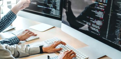 Developing programmer Team Development Website design and coding technologies working in software company office