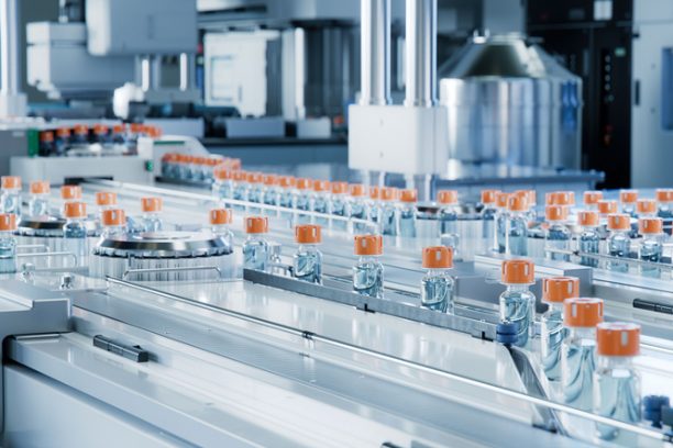 Advanced Bright Modern Pharmaceutical Factory. Medical Ampoule Production Line. Rows of Glass Vials with Orange Caps on Conveyor Belt. Vaccine Production Facility. Medication Manufacturing Process.