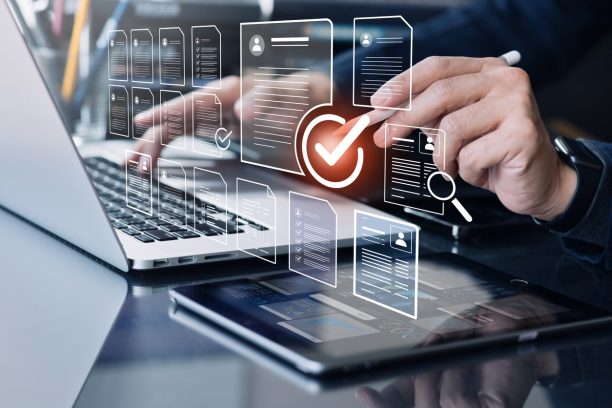 Businessman check marks,checkboxes with electronic survey form or digital document file.organizations and human resource management.big data analysis for survey statistics